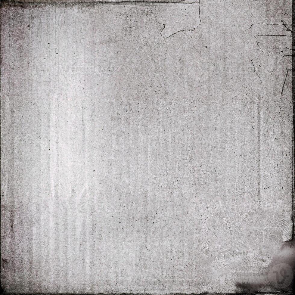 A grungy, vintage textured paper background with visible wear and tear, cracks, and subtle creases. photo