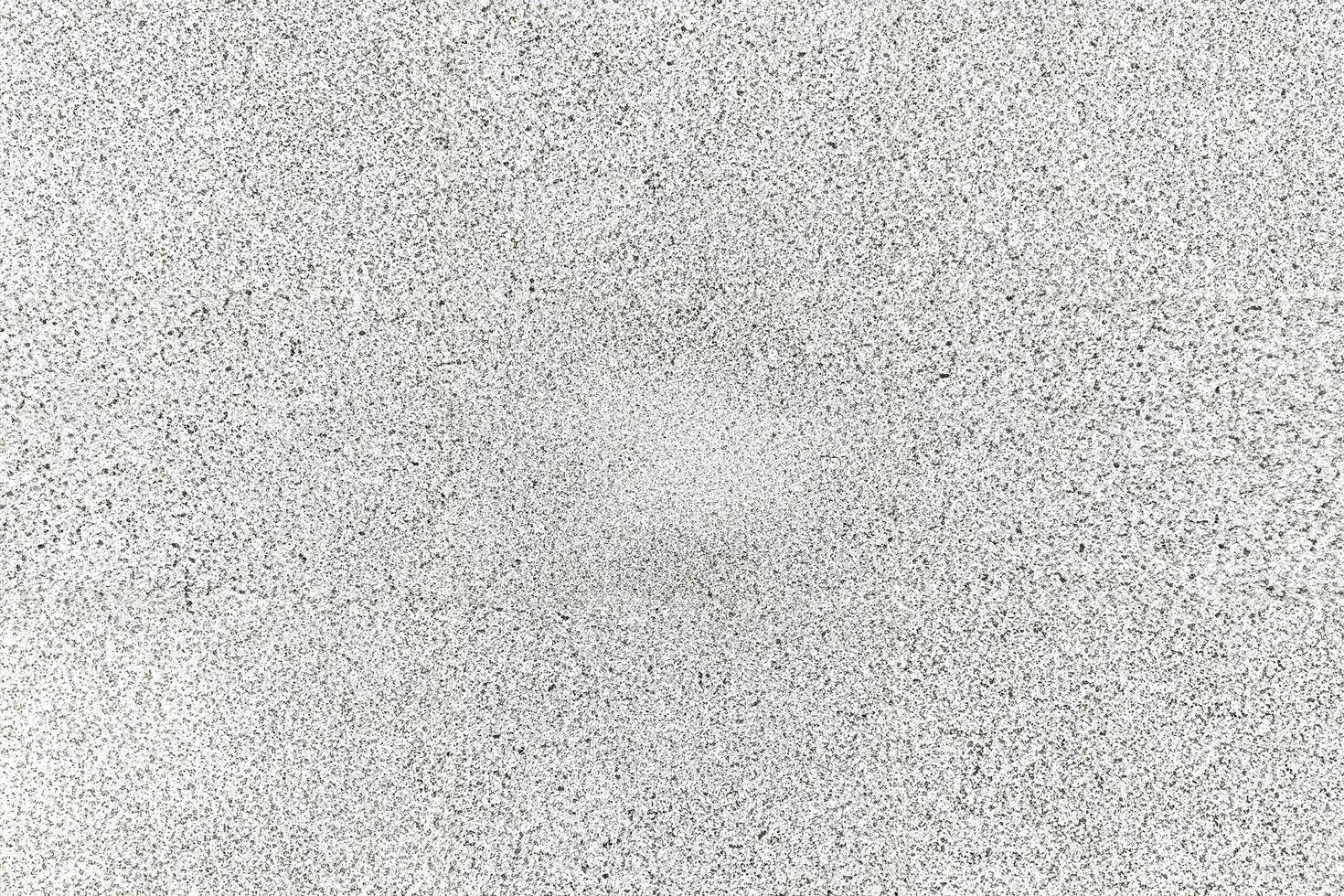 A seamless white speckled texture with a rough, granular pattern, ideal for design and graphic overlays. photo