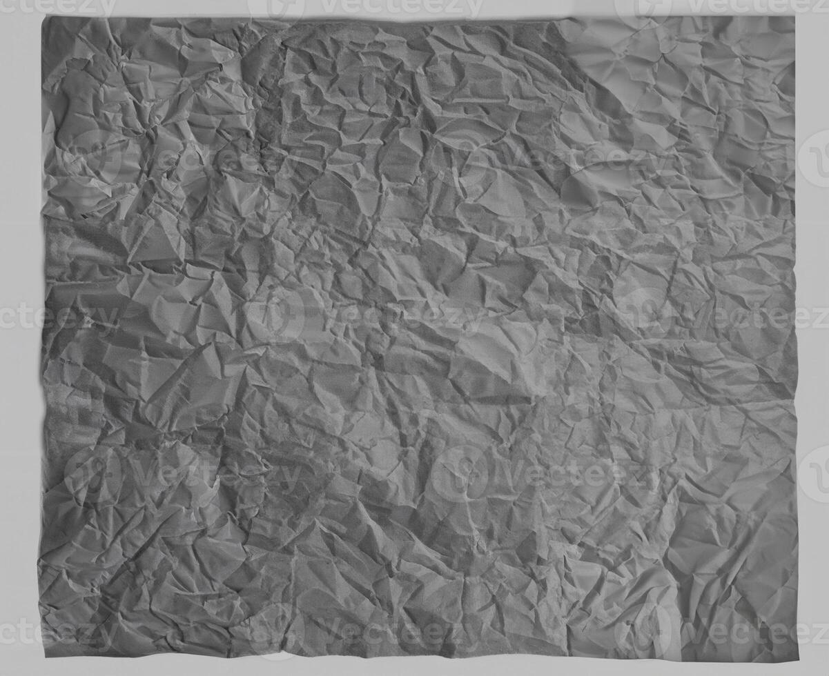 Wrinkled gray paper texture with realistic creases, ideal for backgrounds, design elements, or overlay effects. photo