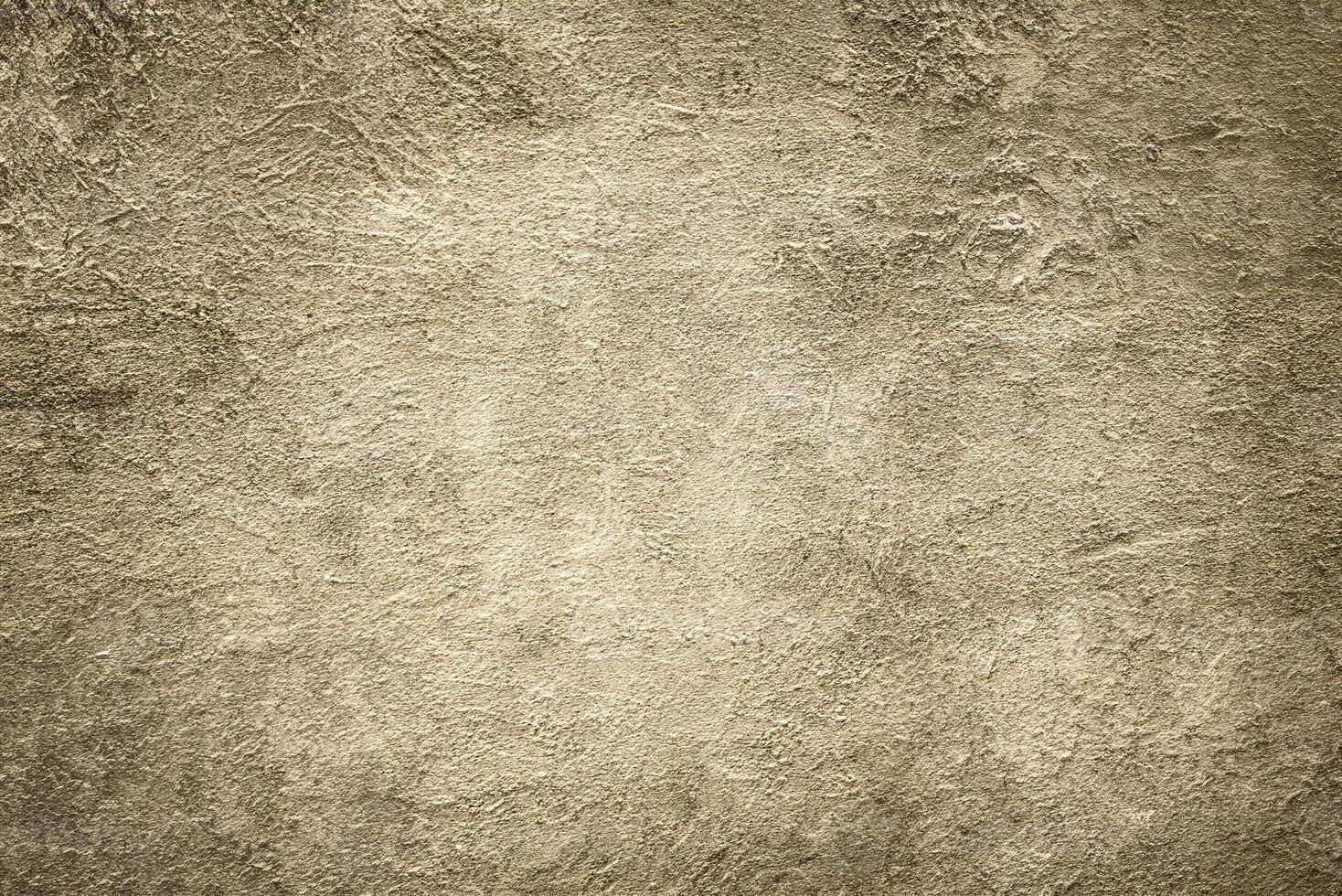 A rough beige textured surface with natural patterns and subtle gradients, ideal for design and artistic use. photo