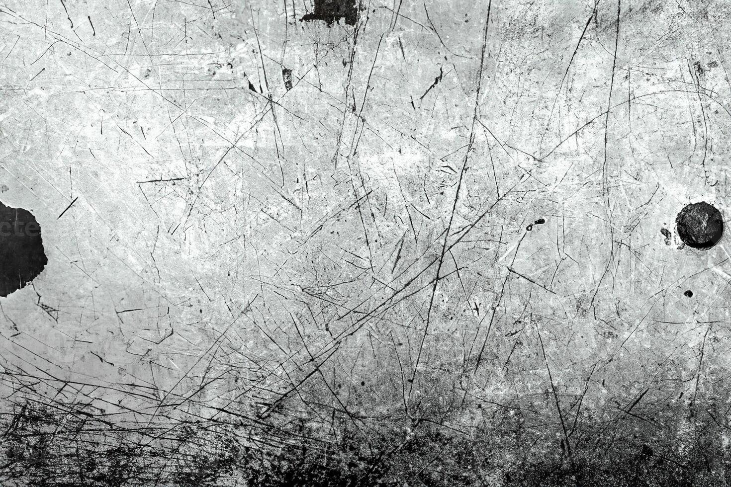 Rough metal surface with scratches, grunge texture, and distressed lines, ideal for industrial design and overlays. photo