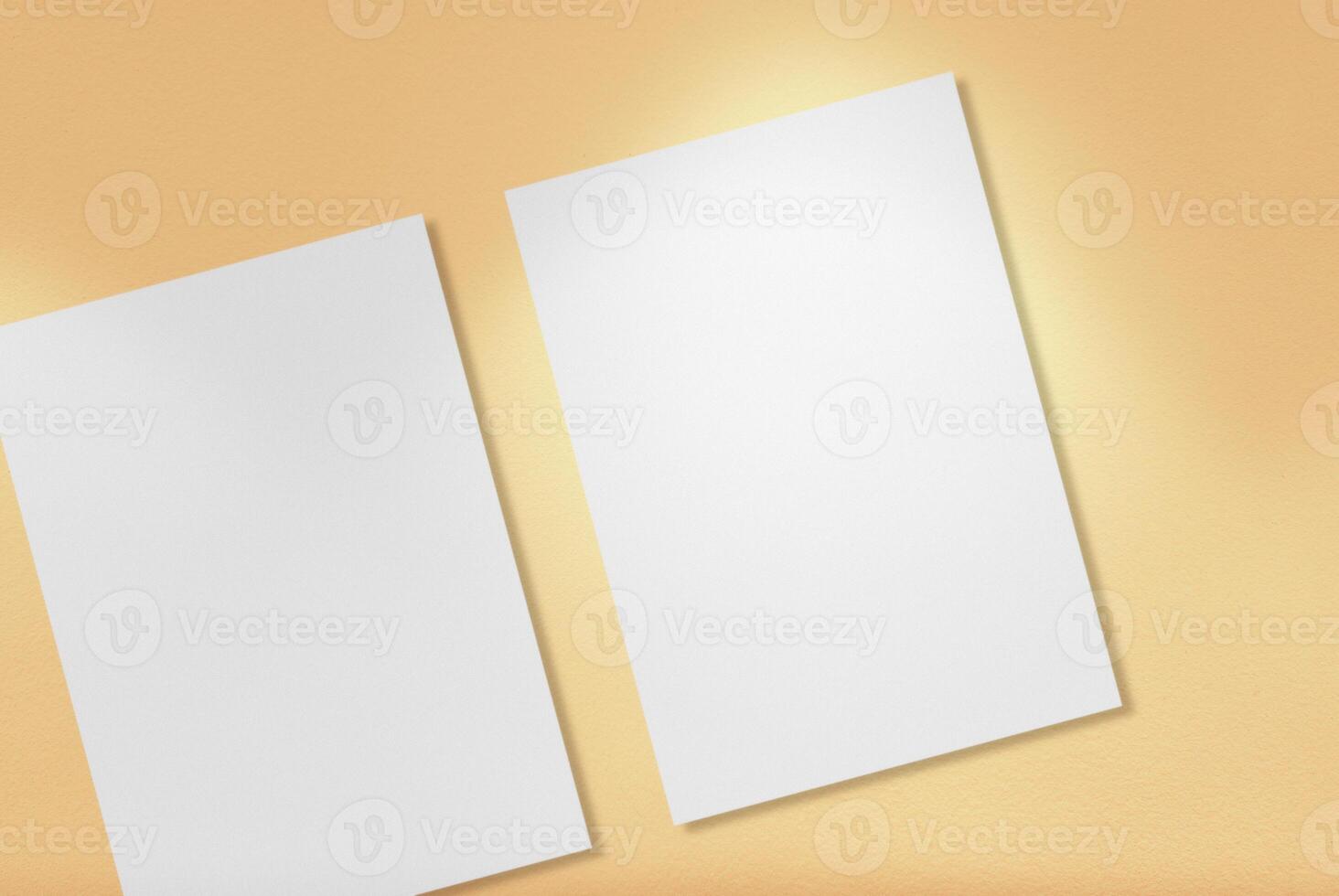 White A4 Papers on Light Gold Background. photo
