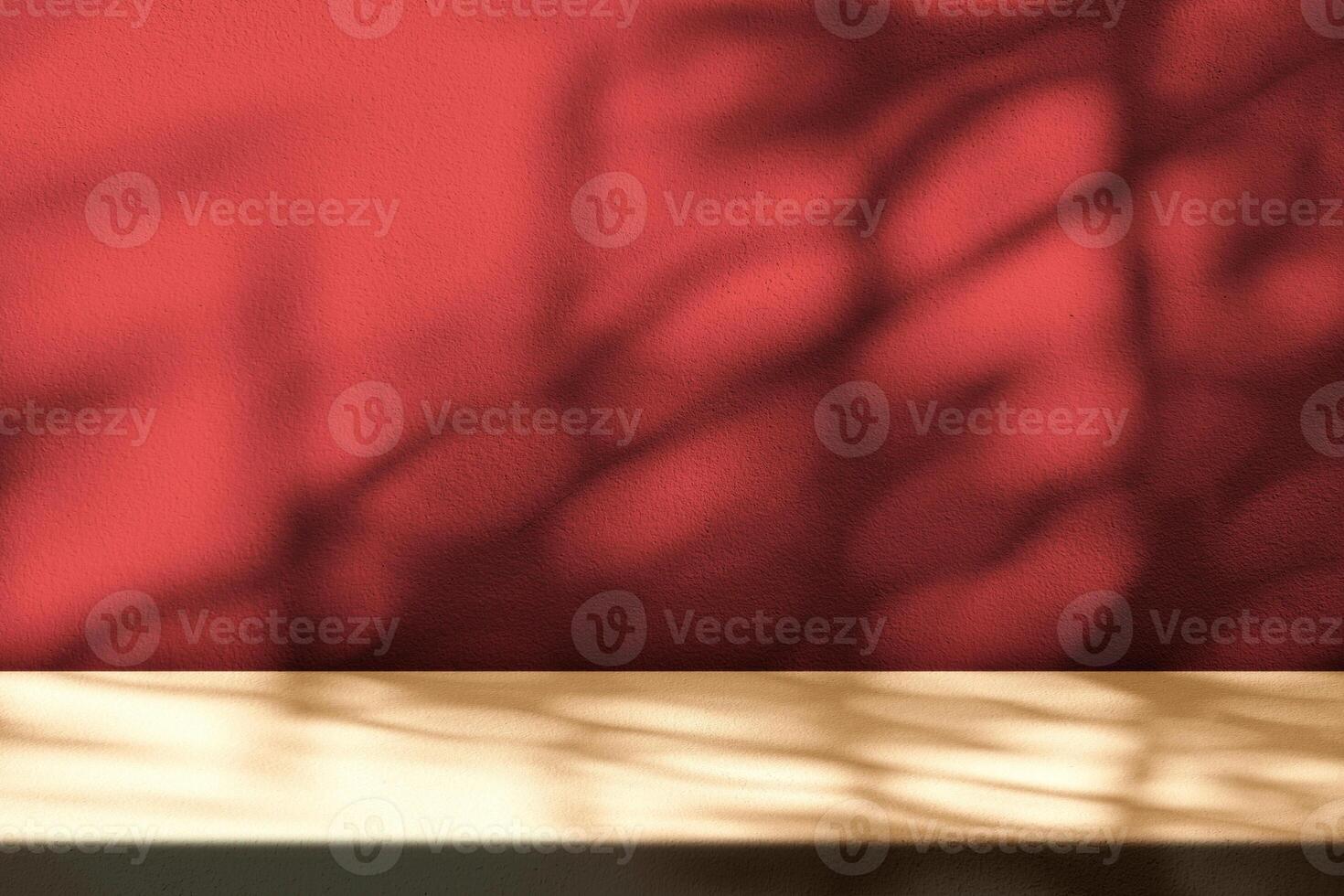 Light Brown Table with Light Beam and Shadow Red Concrete Wall. photo