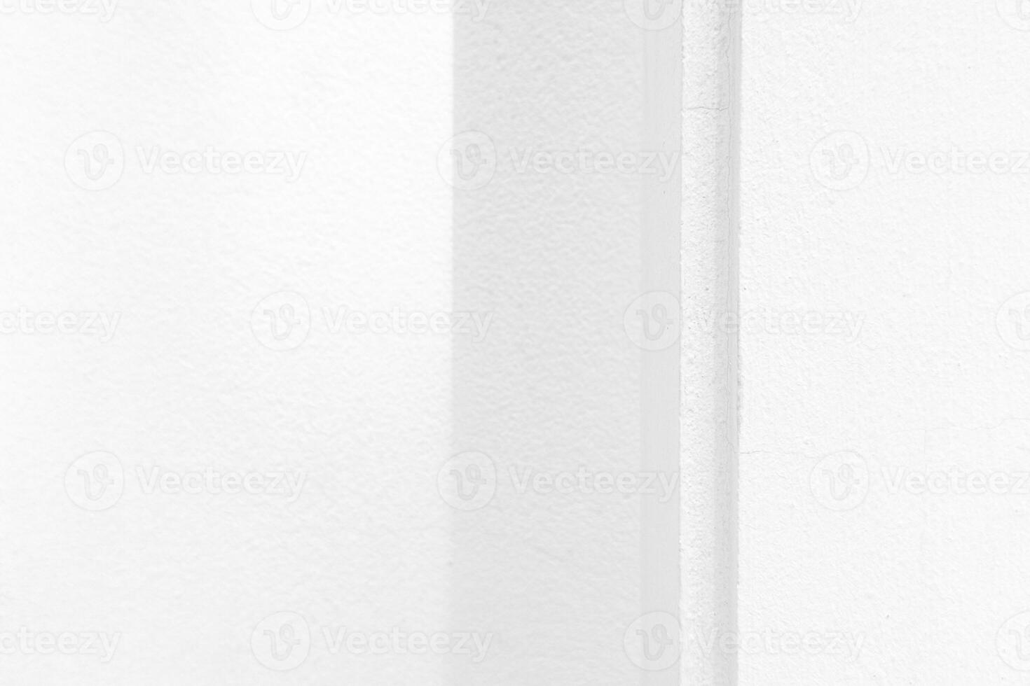White Pole and Gray Wall Background with Natural Light and Shadow on the Surface. photo