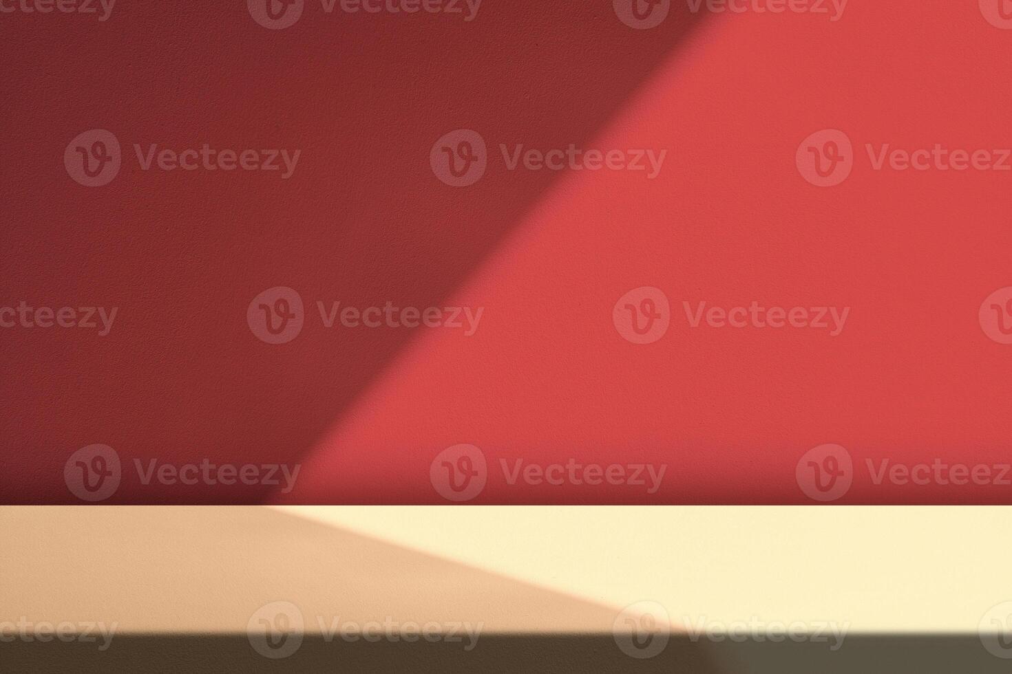 Concrete Table with Light Beam and Shadow on Red Wall Background photo