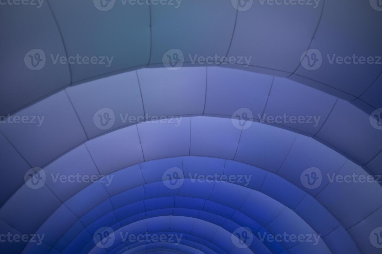 Inflatable structure in detail. Texture of arc lines. Purple glow on the structure. photo
