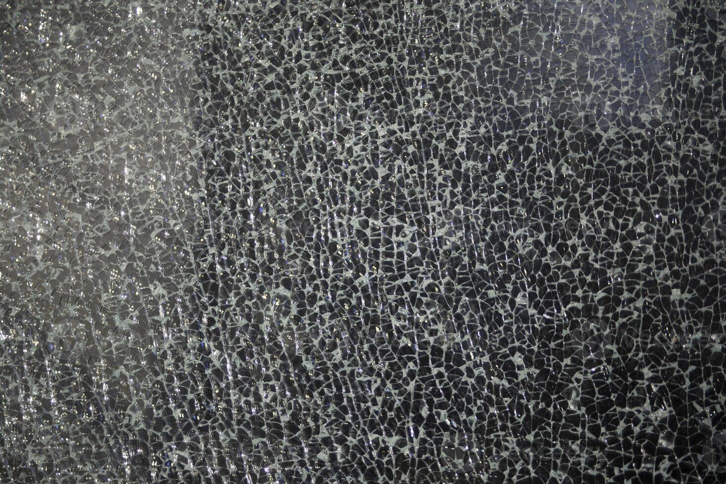 Small cracks on the glass. Broken window. Shards on the glass. photo