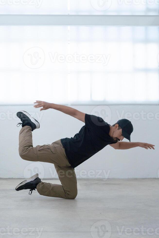 cool looking dancer makes a difficult trick photo