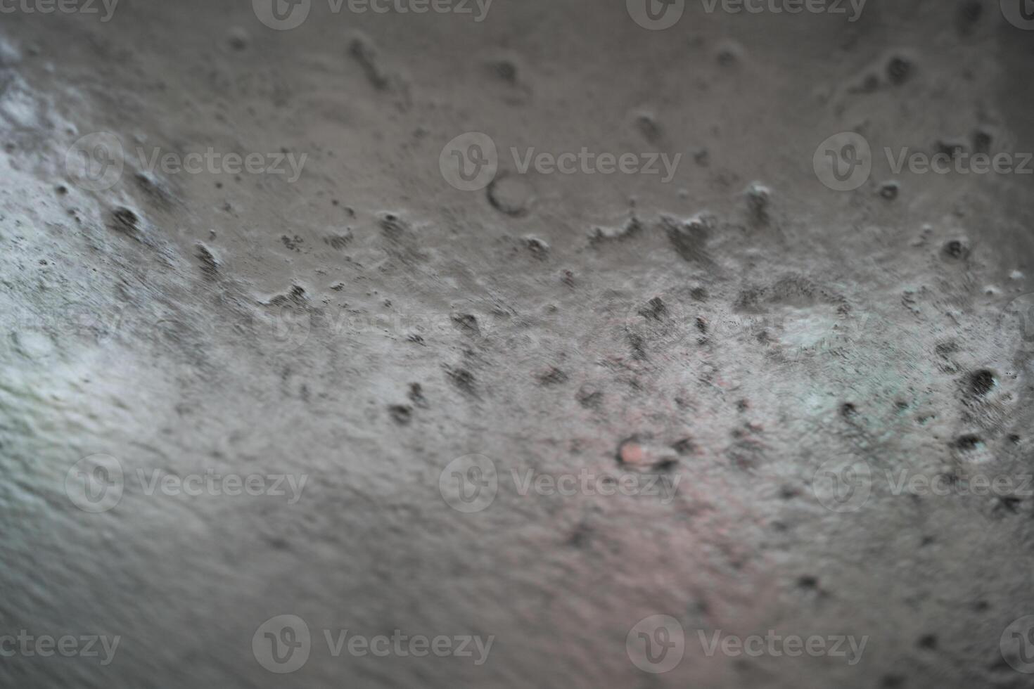Soapy car windshield view from inside a car during an automatic wash cycle. photo