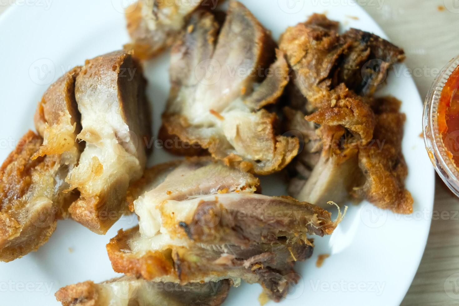 Crispy fried pork legs. Crispy pork cut into bite-sized pieces. photo