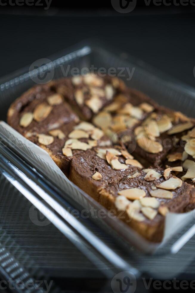 Chocolate cream on toast bread with with almond topping photo