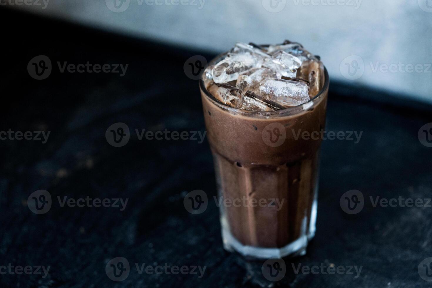 Refreshing iced coffee Mocha filled with ice cubes. photo