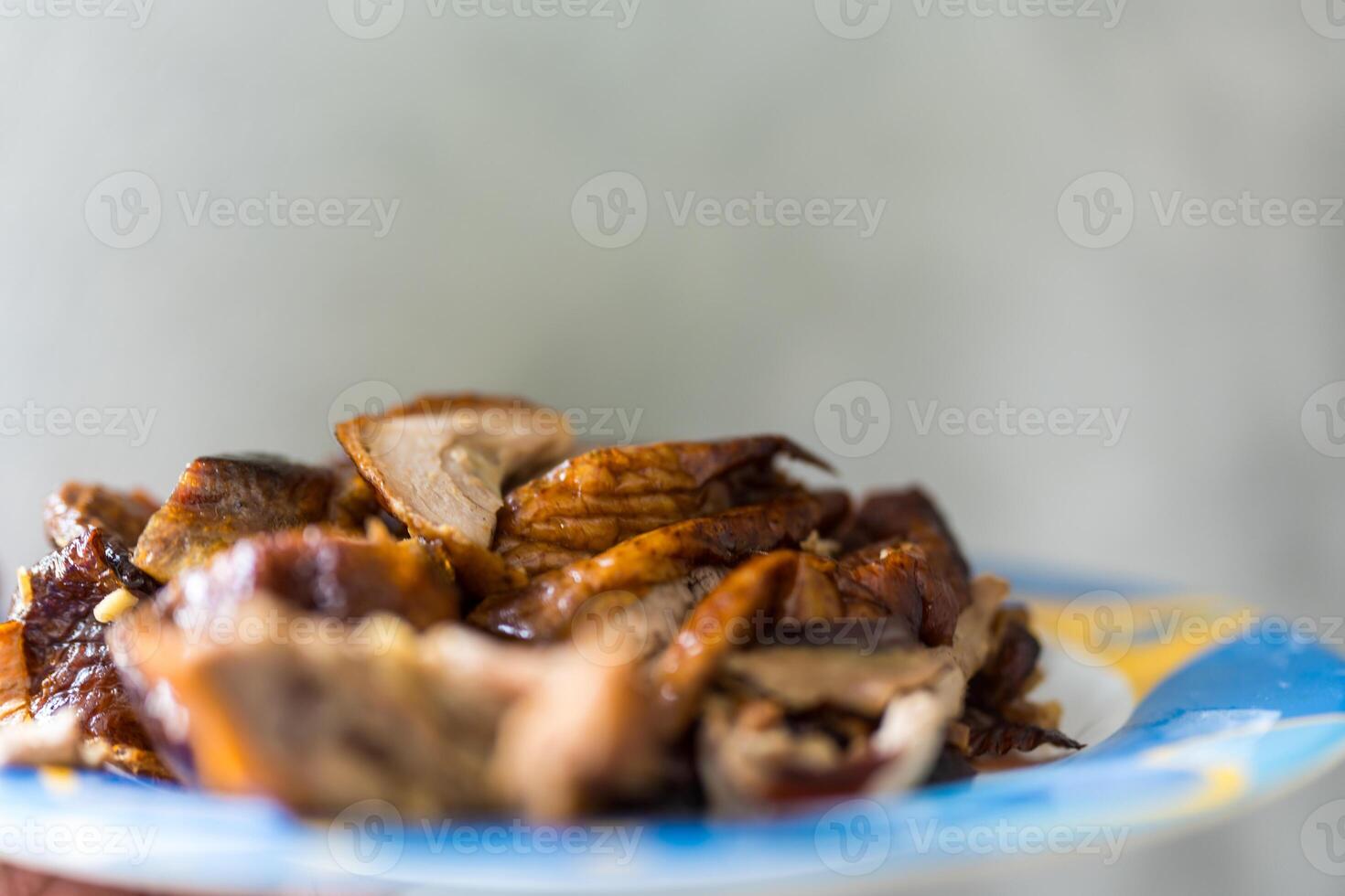 Slice of savoury crispy roast duck photo
