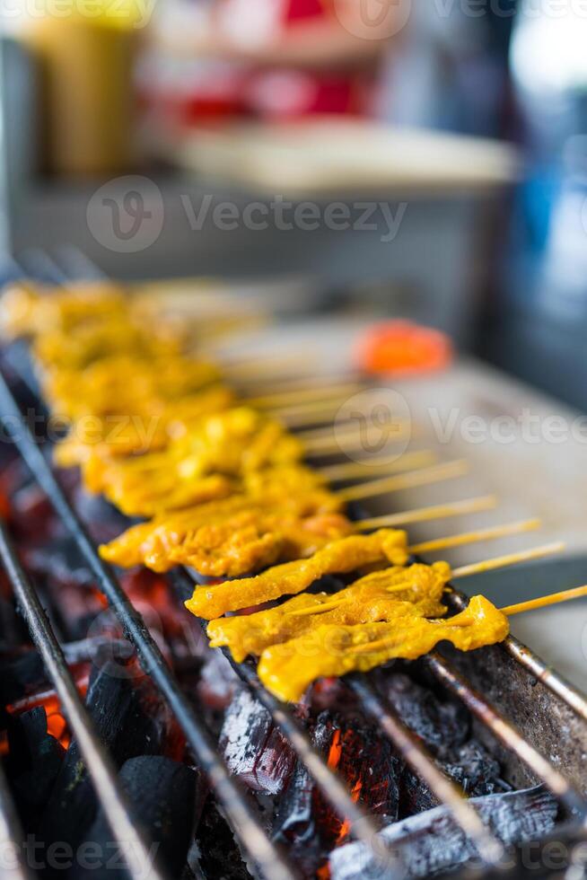 Pork Satay is the popular grilled street food in Thailand photo