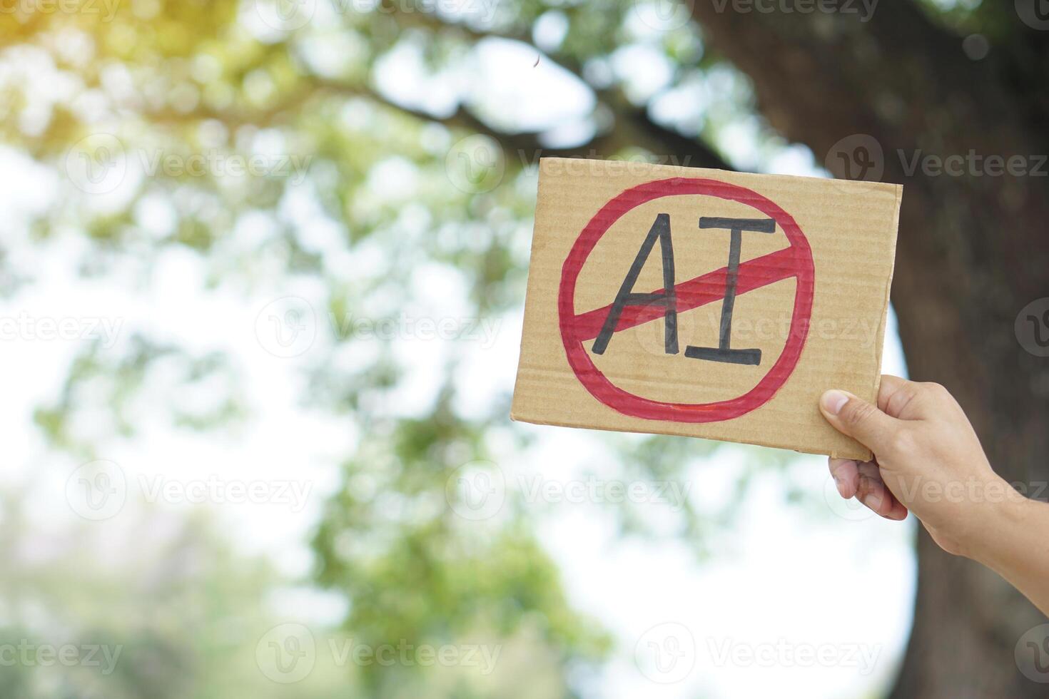 Close up hand holds paper card with No AI, prohibition sign. Concept, disagree, anti or don't support or not allow to use AI or Artificial Intelligence in daily life. photo