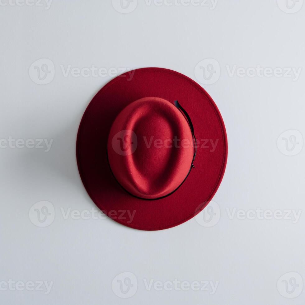 A stylish red hat viewed from above, showcasing its unique shape and vibrant color. photo