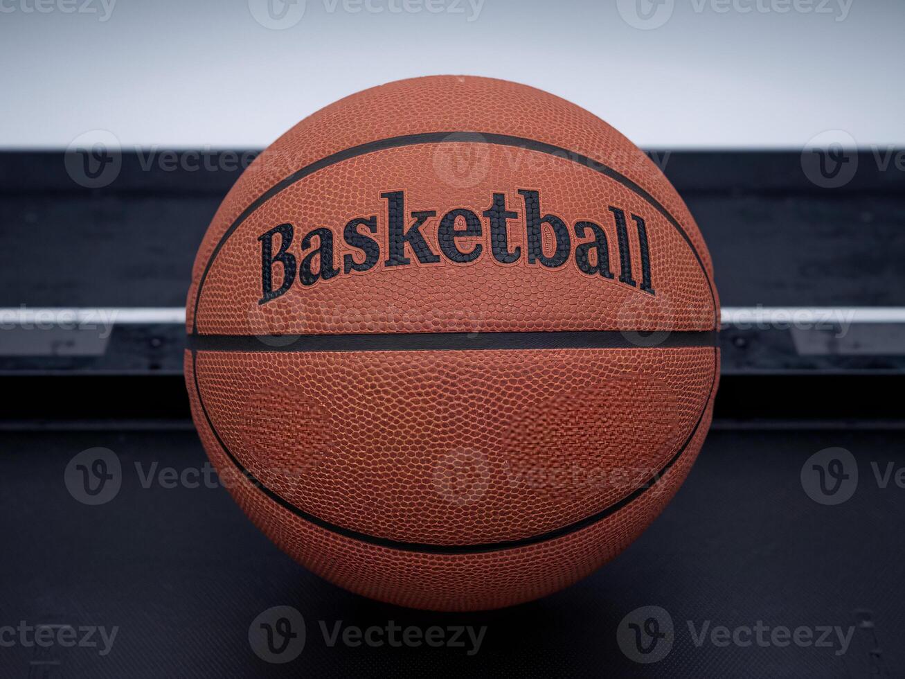 An orange basketball featuring the word 'Basketball' prominently displayed. photo