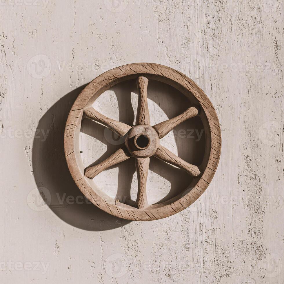 A rustic wooden wheel hanging on a textured wall, showcasing craftsmanship and natural tones. photo