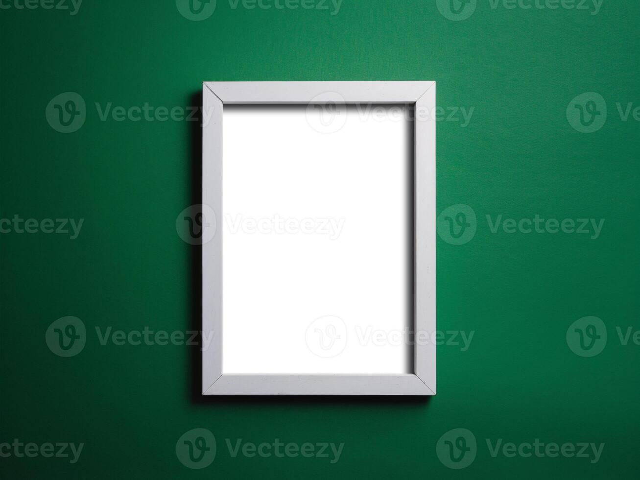Empty white frame on a vibrant green background, perfect for showcasing artwork or photos. photo