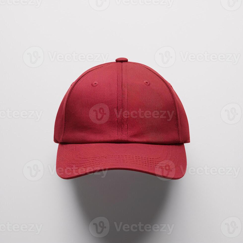 A stylish red cap displayed against a clean white background. photo