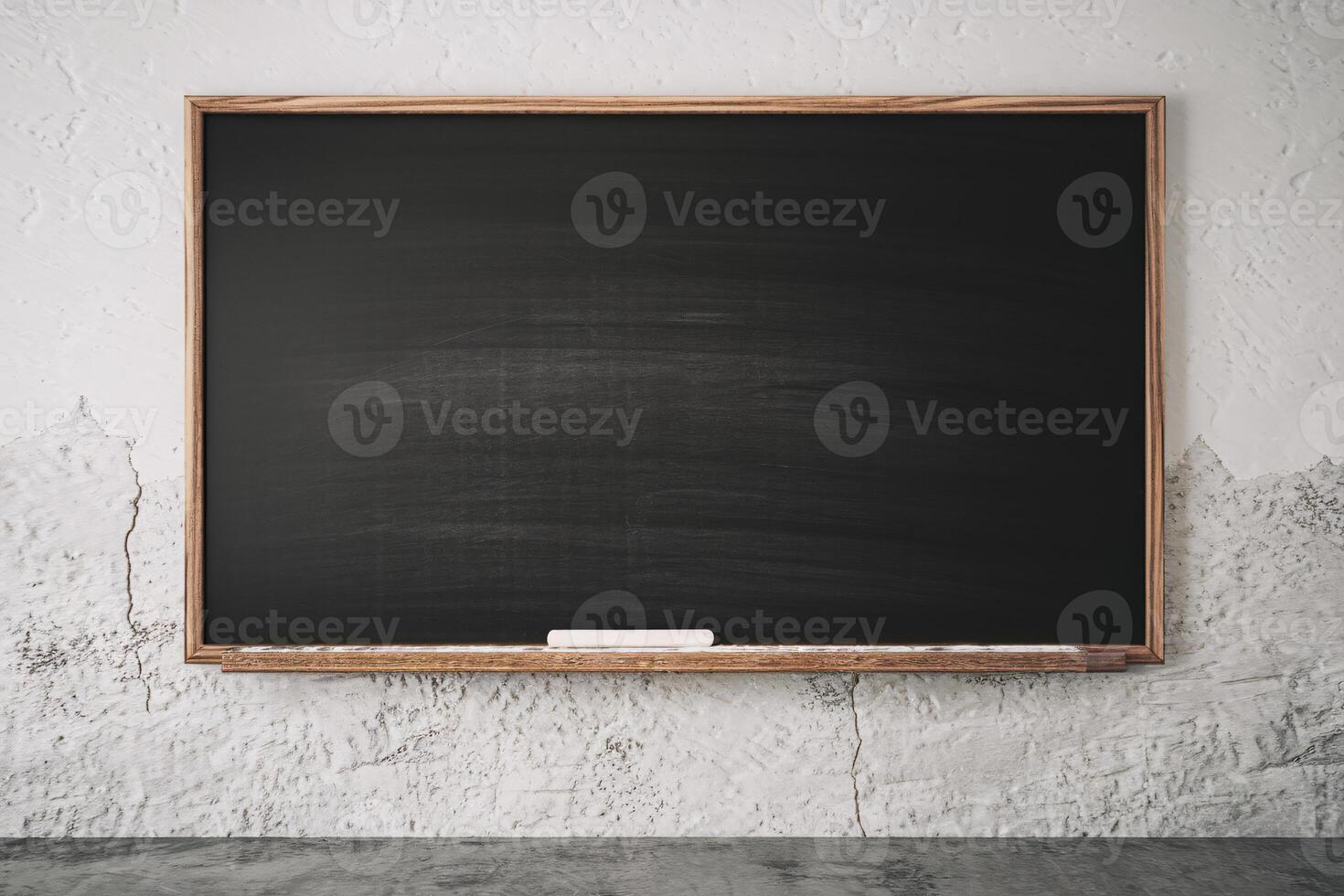 Empty chalkboard in a classroom setting with a rustic wall background. photo