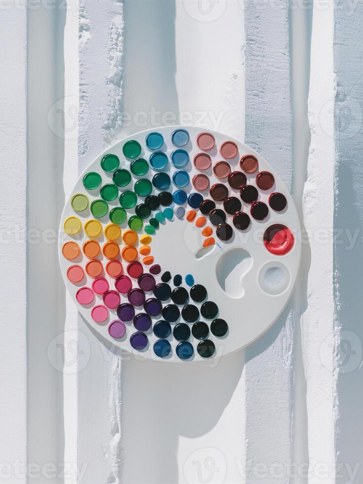 A vibrant artist's palette featuring a spectrum of colors, ideal for creative expression and artistic endeavors. photo