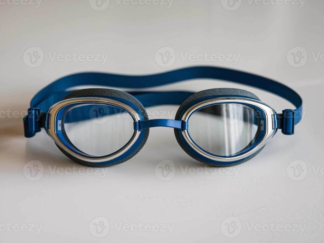 Blue swimming goggles with a sleek design, ideal for competitive swimmers or recreational use. photo