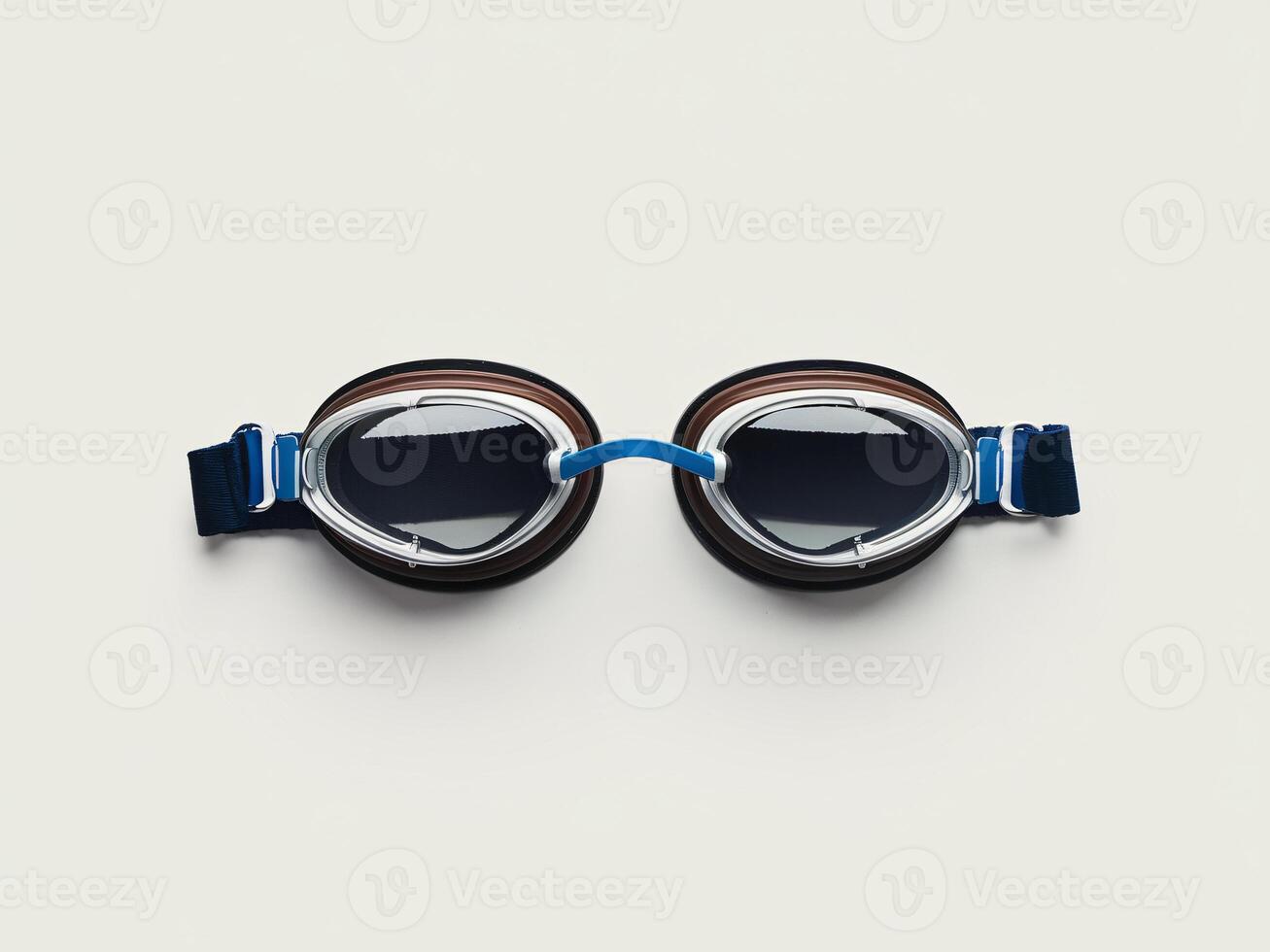 A pair of sleek swim goggles with a blue strap and tinted lenses, perfect for pool enthusiasts. photo