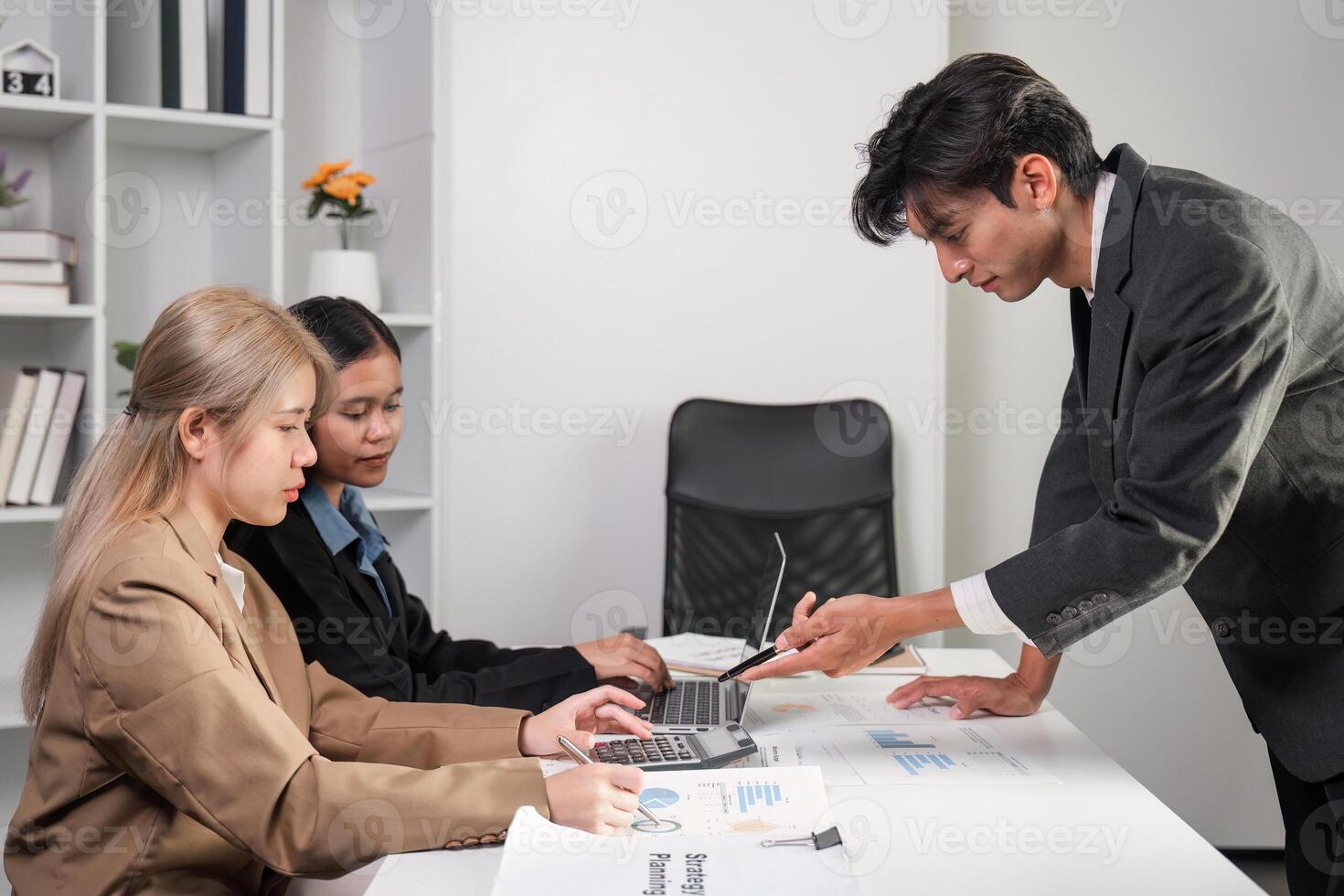 Diverse Business Team Engaged in a Productive Meeting to Discuss Strategies and Solutions in a Modern Office Setting photo