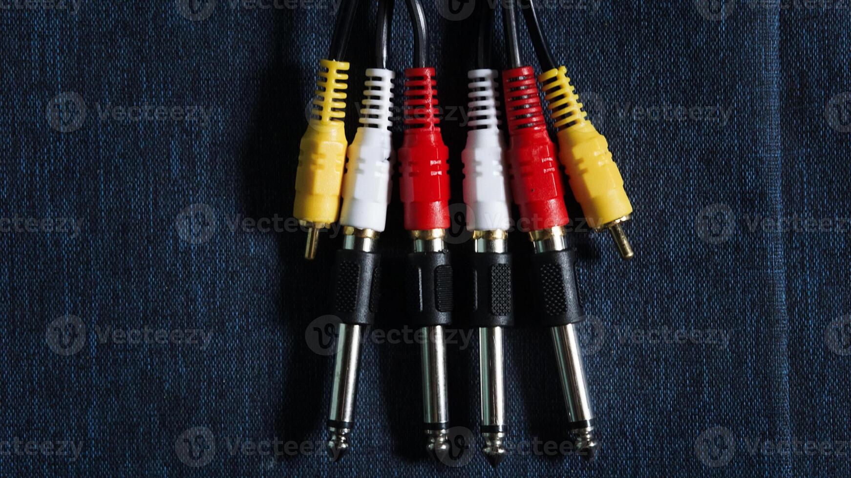 a set of three audio cables with red, yellow and black wires photo