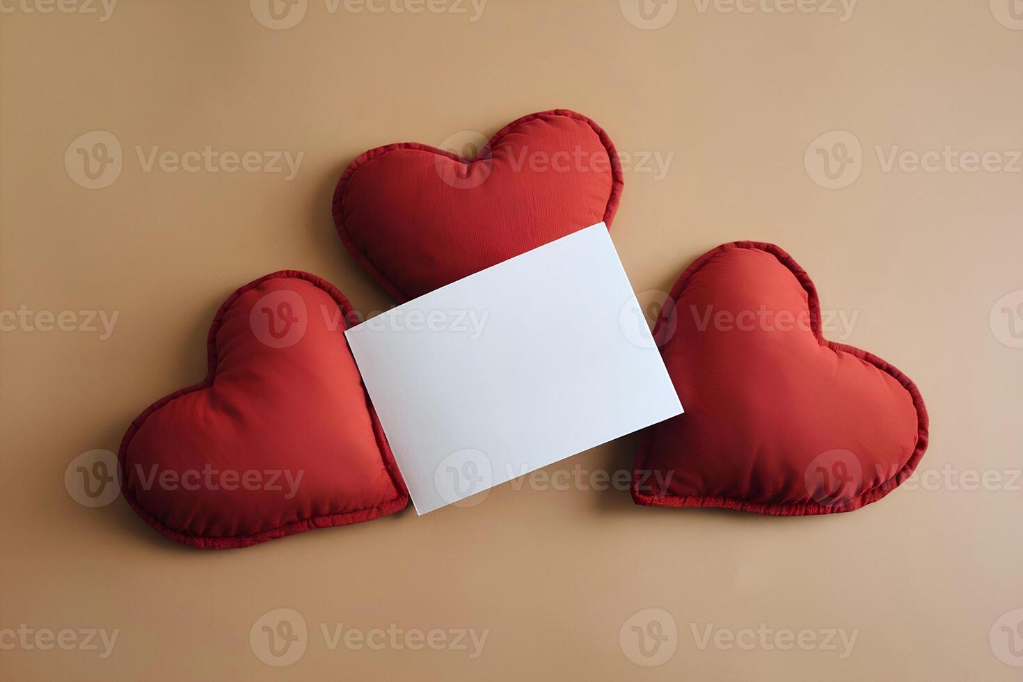 A blank white card mockup is presented on three heart shape red pillows representing Valentines Day photo
