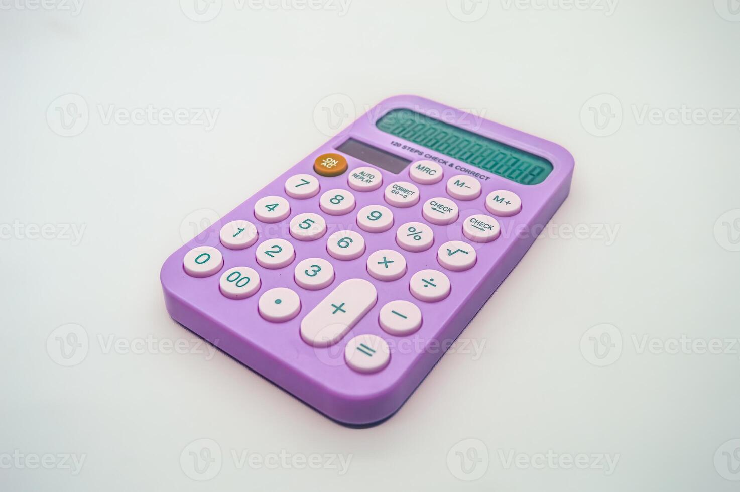 A vibrant purple calculator with pink buttons on a white background. The calculator displays numbers on its screen and features basic arithmetic functions, making it ideal for everyday calculations photo