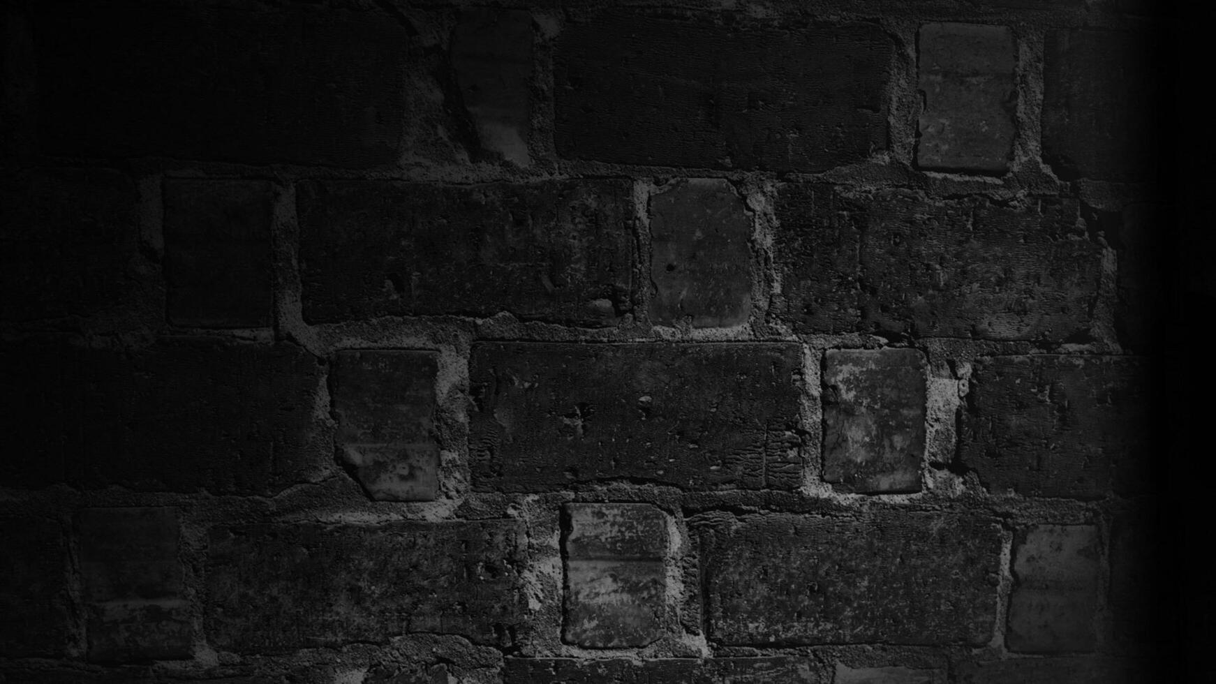 a black and white photo of a brick wall