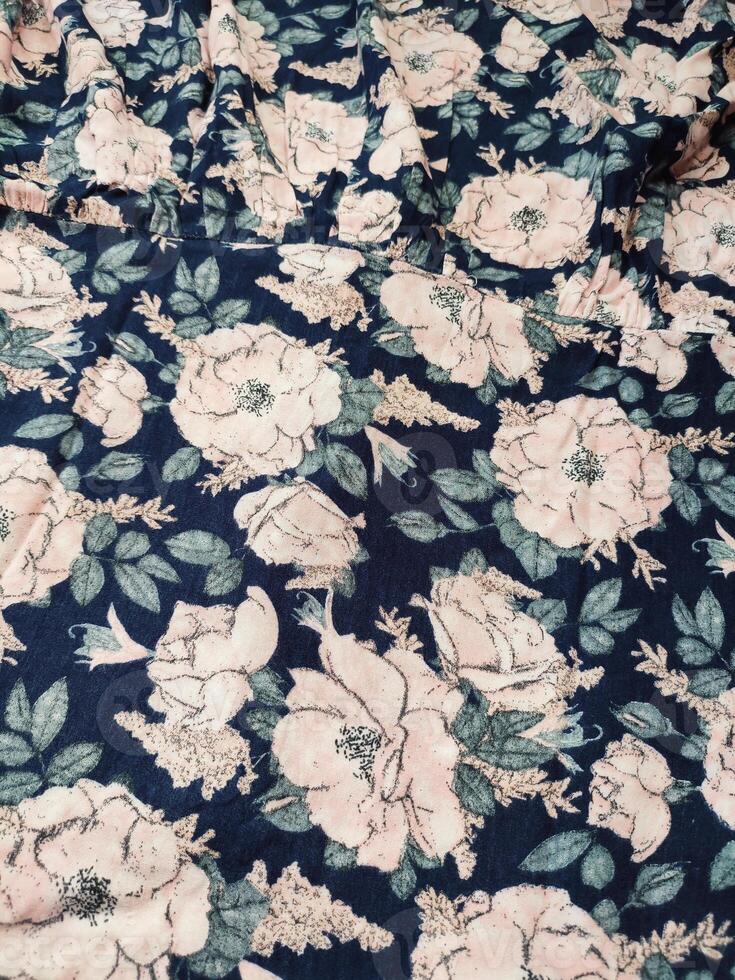 A series of abstract multi-colored rose flower patterns in medium color, rose material fabric solid blue background photo