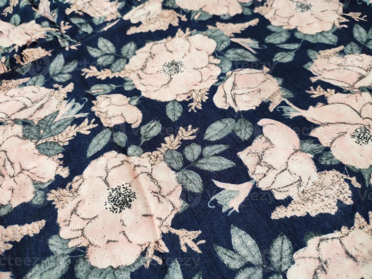 A series of abstract multi-colored rose flower patterns in medium color, rose material fabric solid blue background photo