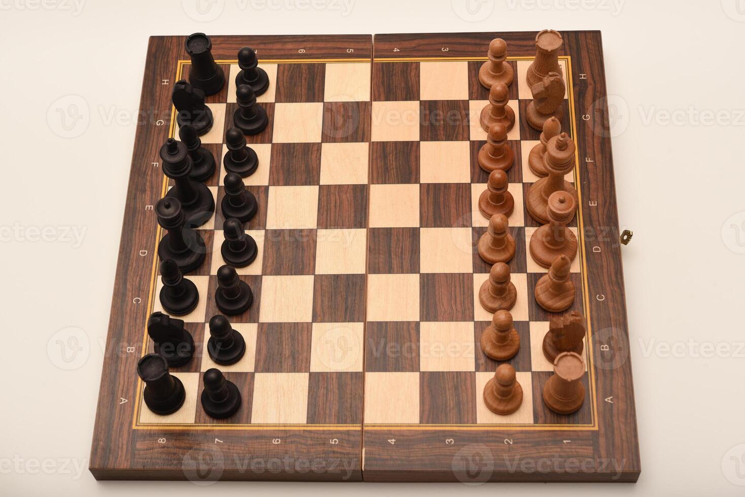 Black and white chess. Wooden chess on a board. A chess game. photo