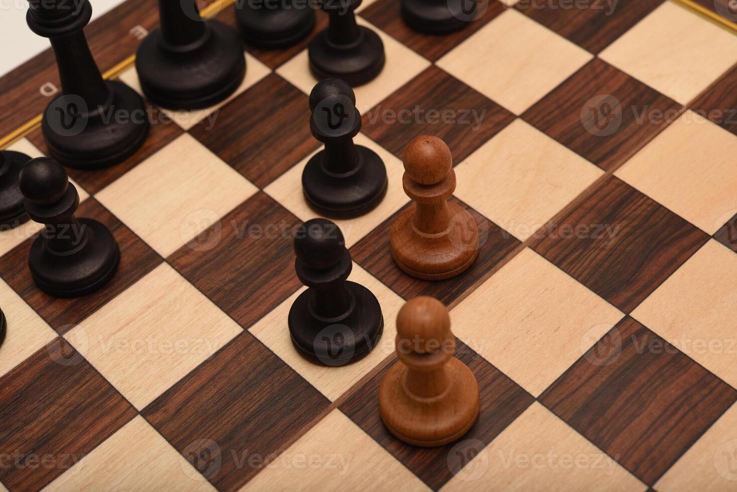 Black and white chess. Wooden chess on a board. A chess game. photo