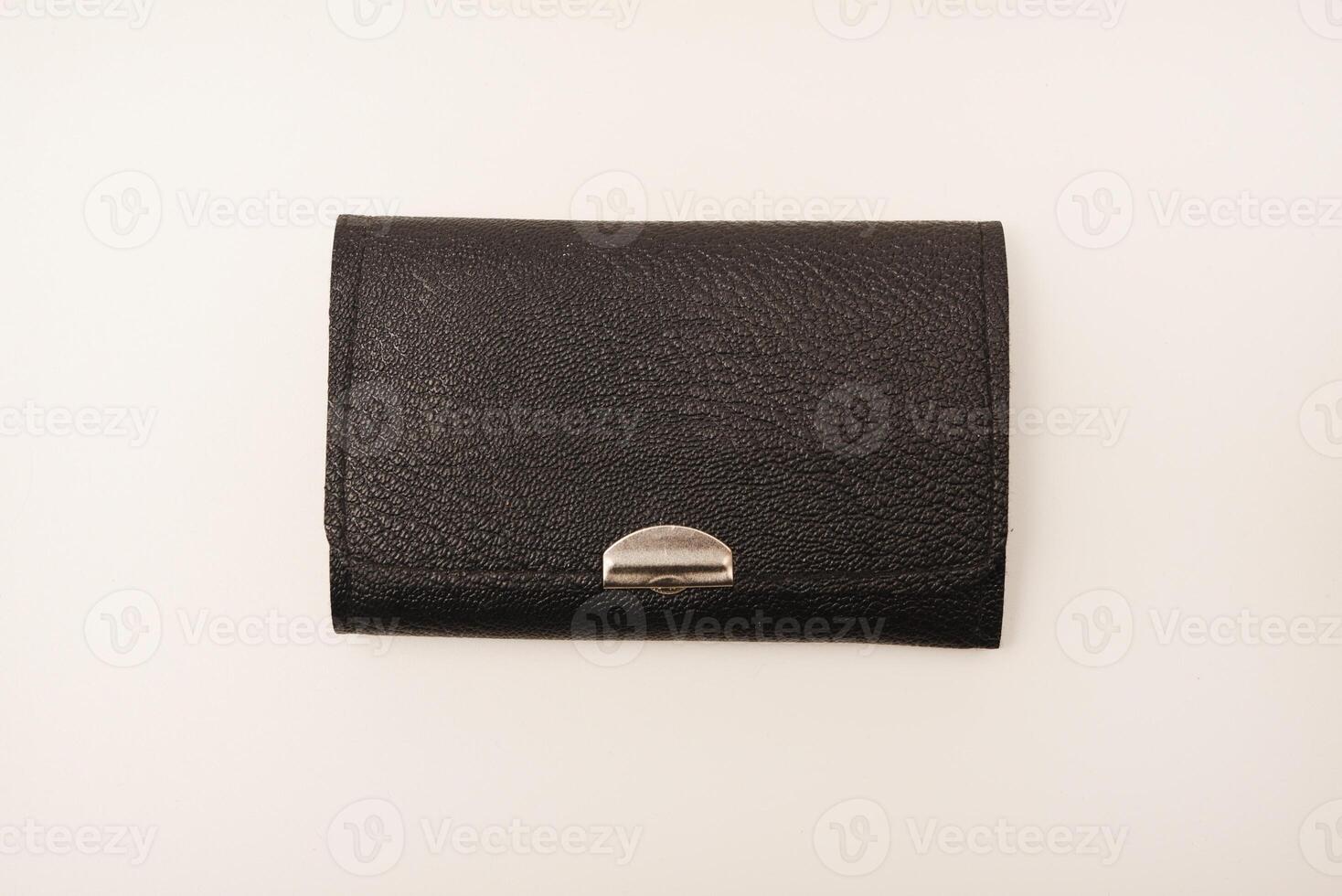 A leather purse with a screwdriver and bits. A set of different screwdrivers. photo