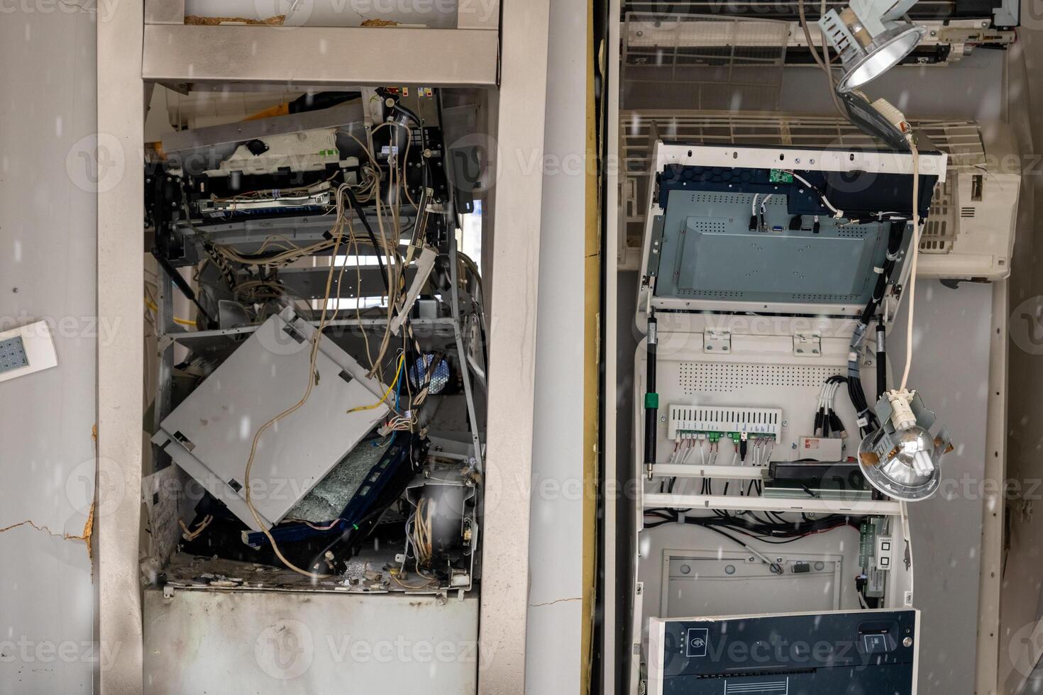 Disassembled electronic equipment inside a maintenance area showcasing intricate components and wiring details photo