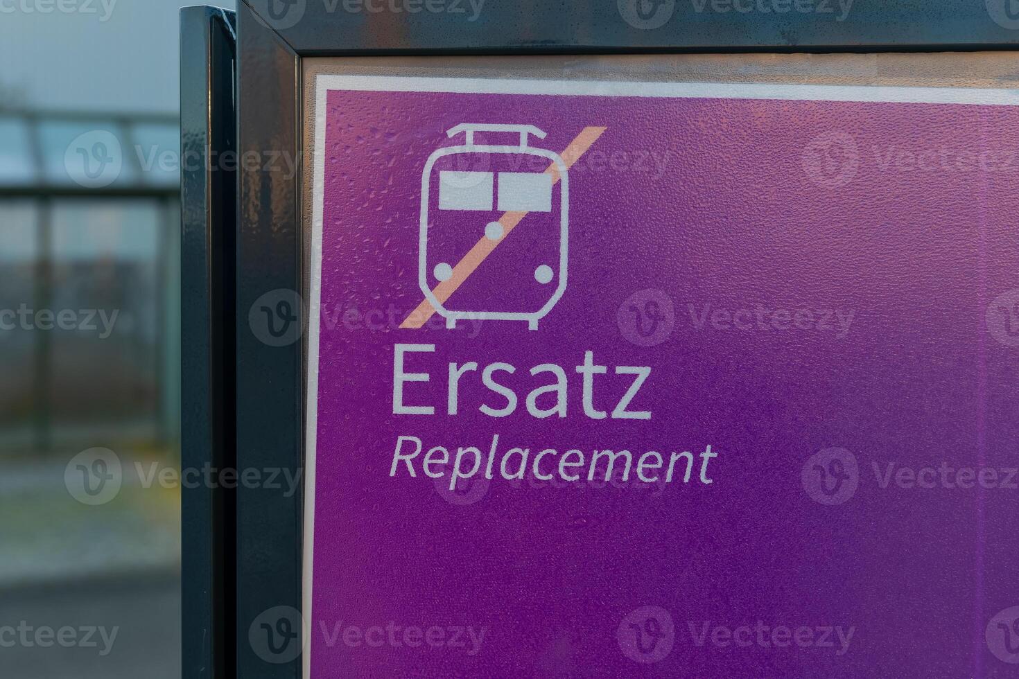 Train replacement announcement sign indicating service interruption at a transportation station for passengers traveling in the area photo