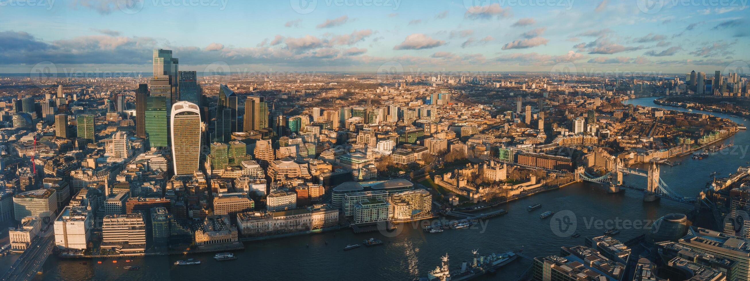 Panoramic View of London with Tower Bridge and Skyscrapers at Sunset photo