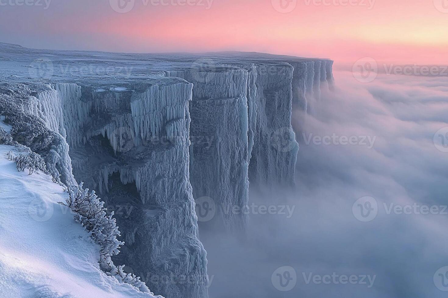 A frozen cliff with ice and snow on top photo