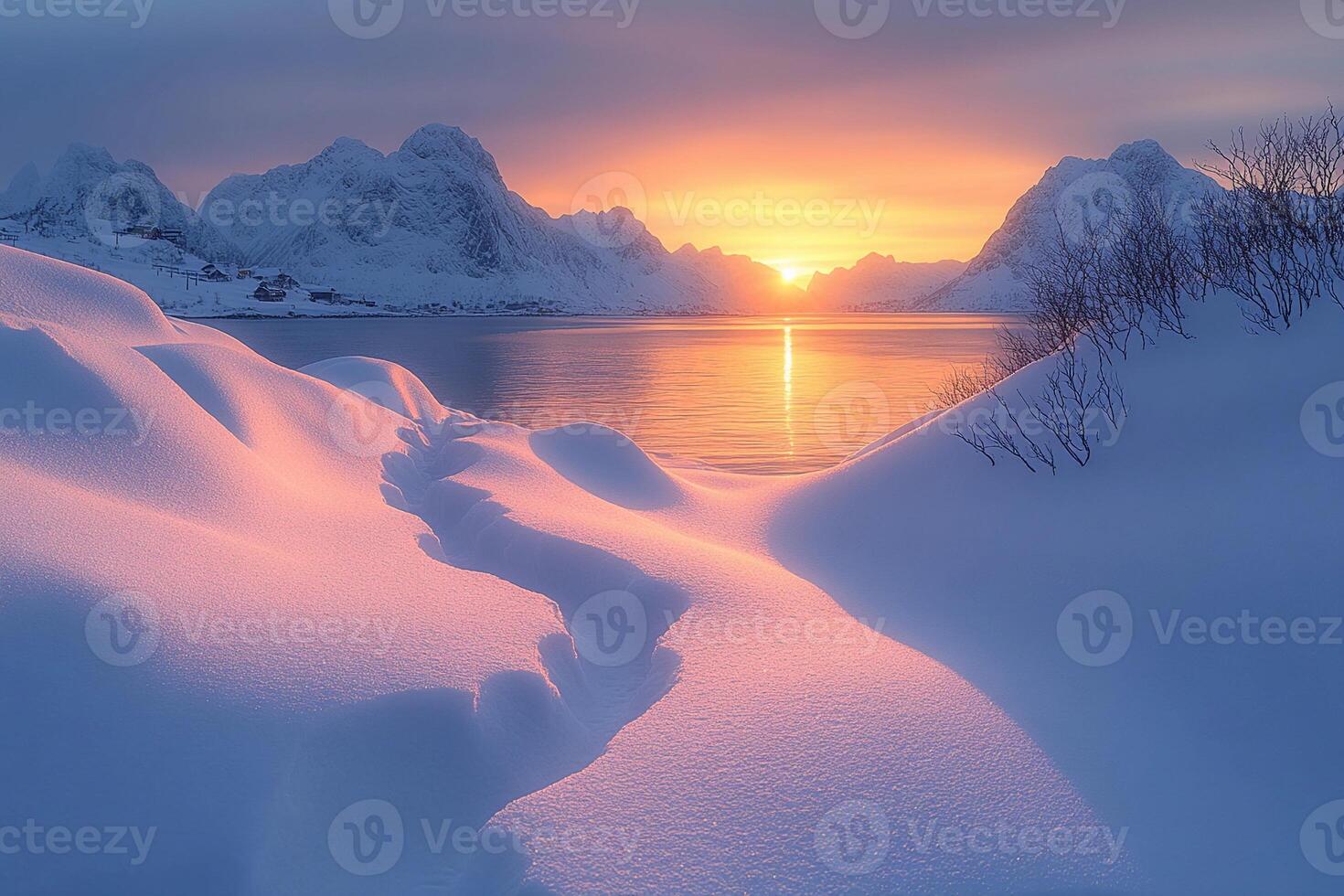 A beautiful sunset over the water and mountains photo