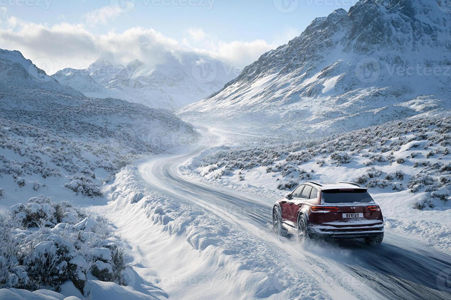 A red suv driving on a snowy road photo