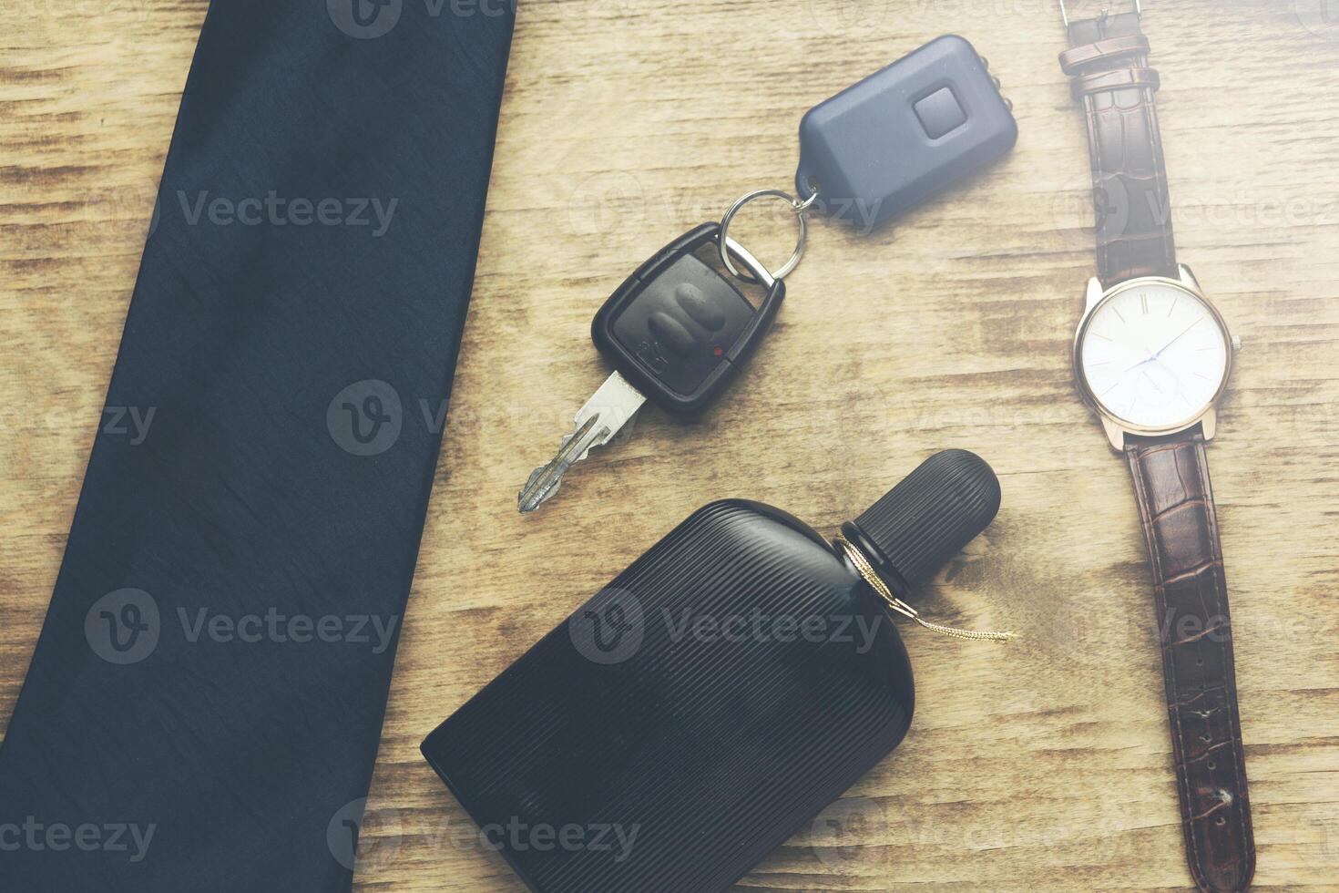 tie,perume,watch and key photo