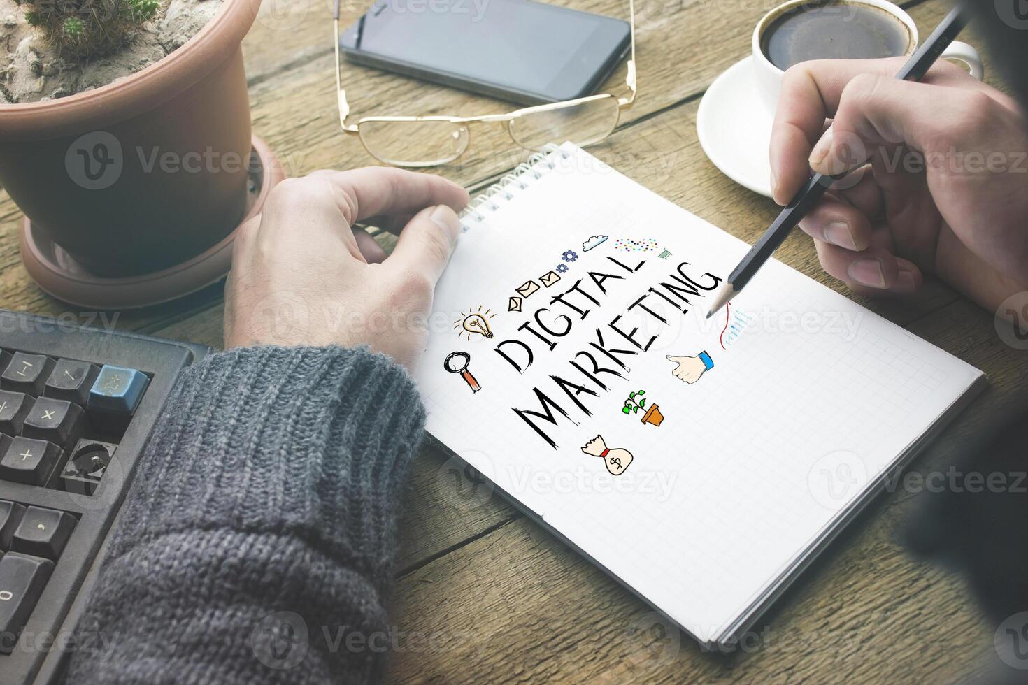 man written digital marketing text on notepad photo
