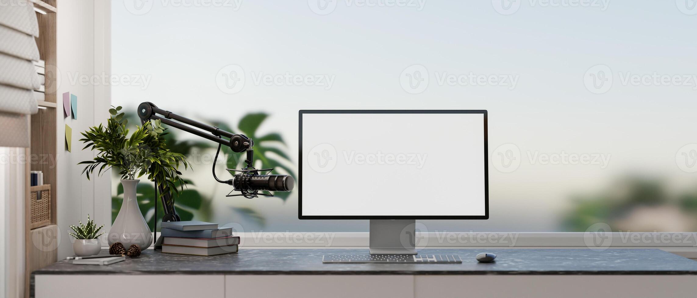 A modern, simple office workspace featuring a computer with a white desktop mockup and a microphone. photo