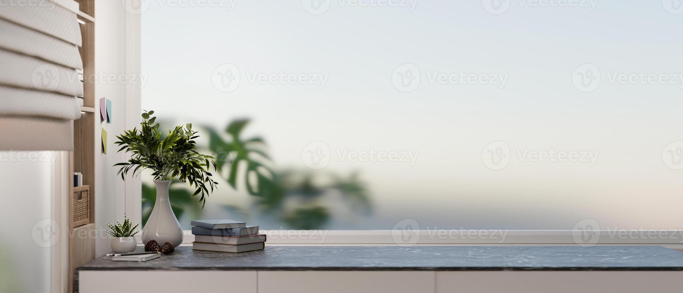 A close-up of a modern desk featuring books and vases in a modern room with a large window. photo