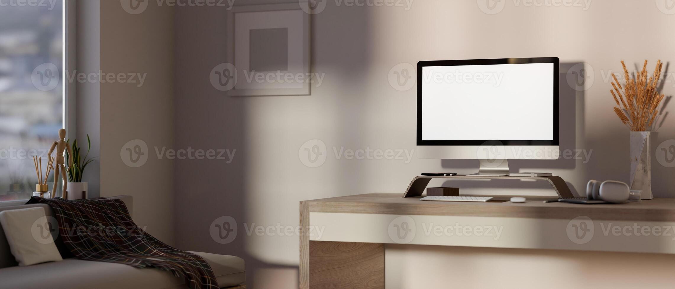 Comfortable, minimalist apartment living room featuring a computer desk, a sofa, and simple decor. photo