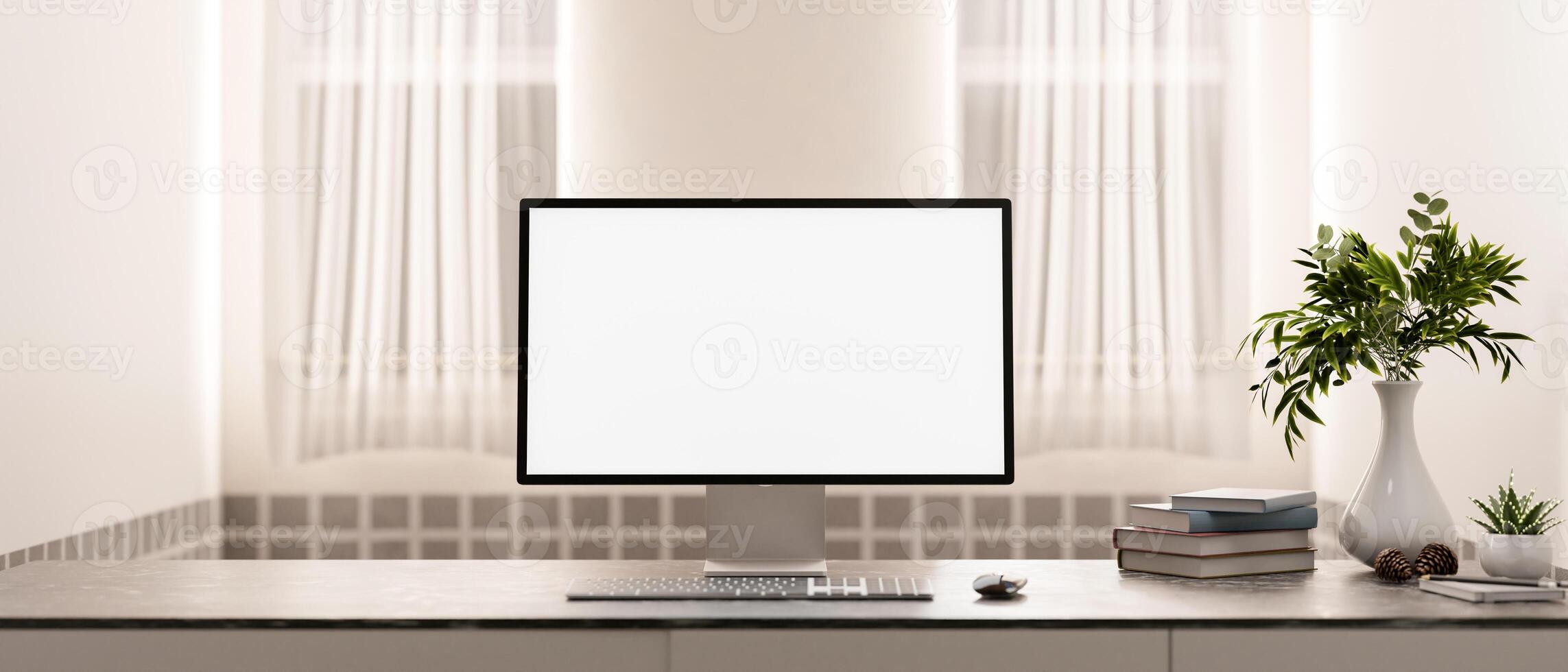 A computer with a white screen mockup and decor on a table in a minimalist and cozy room. photo